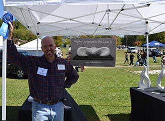 Come by Lee Newton Park and watch Sculptor, Bill Cook, Jr. Carve a Marble Piece for the Chamber