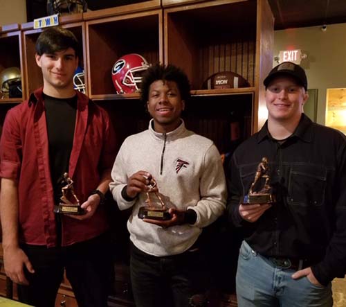 L-R:   Junior Ben Harrison, Senior JaRon Davie and Senior Harrison Hardage received 2018 NHFA All Star Team award given to stand out players. 